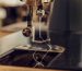 Close-up image of the needle of a vintage sewing machine.